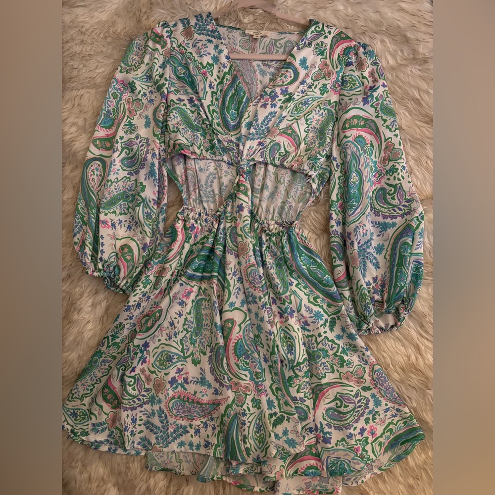 Cute vibrant dress with open sides.